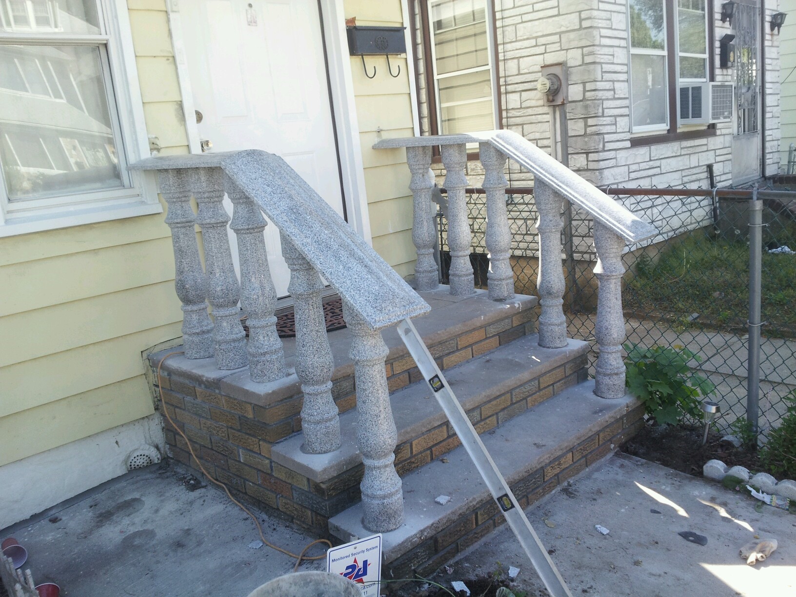 Stairs undergoing a transformation as they are painted with bright colors for a fresh look.